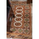 A ground orange prayer mat 125cm x 80cm