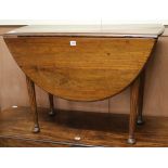 A George III mahogany oval topped drop leaf dining table W.97cm
