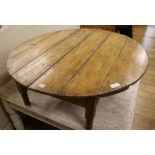 A circular pine coffee table W.106cm