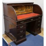 A late Victorian mahogany roll top desk W.122cm