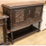 A late Victorian carved oak sideboard, with undertier, W.118cm