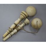 Two ivory cup and ball toys