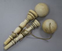 Two ivory cup and ball toys