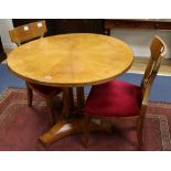 A Biedermeier circular topped satin birch table and a pair of chairs W.97cm