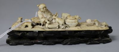 An 18th/19th century Chinese ivory figure of a sage, wood stand 9.5cm