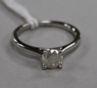 A diamond solitaire ring, 18ct white gold setting, size M.