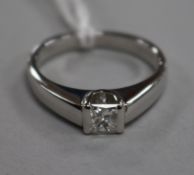An 18ct white gold and princess cut solitaire diamond ring, size K.