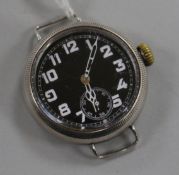 A gentleman's early 20th century silver manual wind wrist watch with black dial and subsidiary