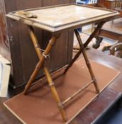 An Indian walnut butler's tray on turned simulated bamboo folding stand, H.68cm