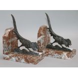 A pair of French Art Deco silvered bronze and marble bookends, signed R. Adnin 15cm.