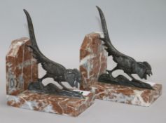 A pair of French Art Deco silvered bronze and marble bookends, signed R. Adnin 15cm.