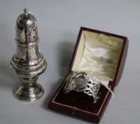 A George V silver caster, London, 1933 and a cased silver napkin ring.