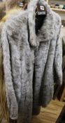 A grey fur coat