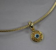 A 14ct gold and blue topaz pendant on a 14ct gold necklet.