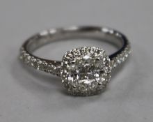 A diamond cluster ring, square setting with diamond-set shoulders, 18ct white gold setting, size M.