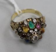 An Indian 18k gold and multi gem set ring, one stone missing, size N.