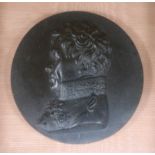 A framed pair of parian plaques and a basalt plaque of Wellington