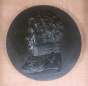 A framed pair of parian plaques and a basalt plaque of Wellington