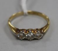An 18ct gold, platinum and three stone diamond ring, size P.