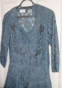 An early 20th century blue lace dress with beaded decoration