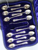 An Edwardian cased set of twelve silver coffee spoons and a pair of sugar tongs, Lee & Wigfull,