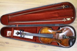 A silver mounted violin bow, an ivory mounted violin bow and a late 19th century German violin,