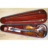 A silver mounted violin bow, an ivory mounted violin bow and a late 19th century German violin,