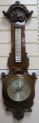 An Edwardian carved aneroid barometer 88cm