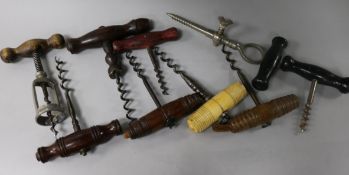 A 19th century bone handled corkscrew and others