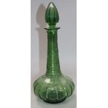 An early Victorian green glass spire decanter 32cm