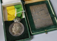 A cased Swedish Fran K. Patriotiska Sallskapet medal and another bronze medallion