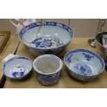 A 19th century Chinese blue and white punch bowl, Diameter 35cm. and three other bowls (a.f.)