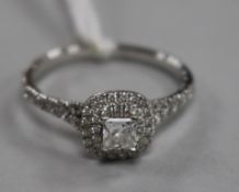 A modern Maple Leaf Diamonds 18ct white gold and diamond cluster dress ring retailed by