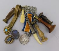 5 sealing stamps T; BE; T; BW and TI, bone dagger ornament, two buckles, brooch, bracelet and a
