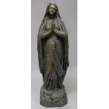 An early 20th century French silvered bronze model of Saint Bernadette, inscribed Casciani et Nau