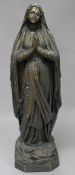 An early 20th century French silvered bronze model of Saint Bernadette, inscribed Casciani et Nau
