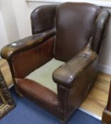 A 1940's French tan leather armchair