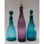 Two Georgian green glass decanters and a later amethyst glass decanter