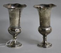 A pair of Edwardian silver spill vases by William Comyns, London, 1907, loaded, 12.8cm.