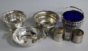 A pierced silver sugar basket, with blue glass liner and six other items, including a plain silver