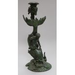 A bronze cherub and dolphin candlestick 26cm