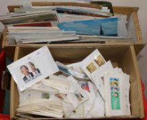 A box of World stamps, in display packers and loose pages and various postcards