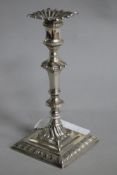 An Edwardian silver taperstick, Johnson, Walker & Tolhurst, London, 1909, loaded, 15.5cm.