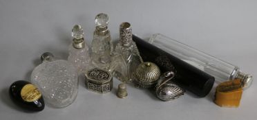 A novelty silver swan pepper, various silver-mounted scent bottles and sundries, including an
