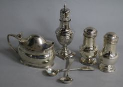A George III silver mustard pot, a Victorian silver caster/pepperette, a pair of silver peppers
