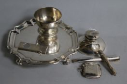 A silver waiter, silver inkwell, small footed bowl, vesta case, cigar cutter and retractable
