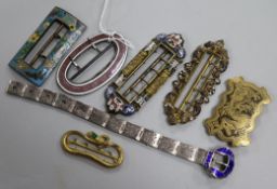 Six assorted buckles including one Edwardian silver and enamel and a white metal and enamel