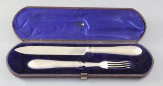 A cased Victorian silver carving knife and fork set, by Martin, Hall & Co, Sheffield, 1871.
