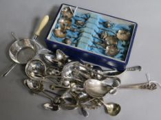 A set of six Chinese decorative sterling silver spoons (cased), a Victorian silver strainer with