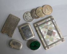 A mother of pearl card case with silver inlay, two silver vesta cases and six other items.